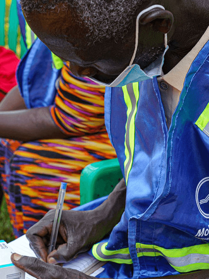 Health worker examining patient